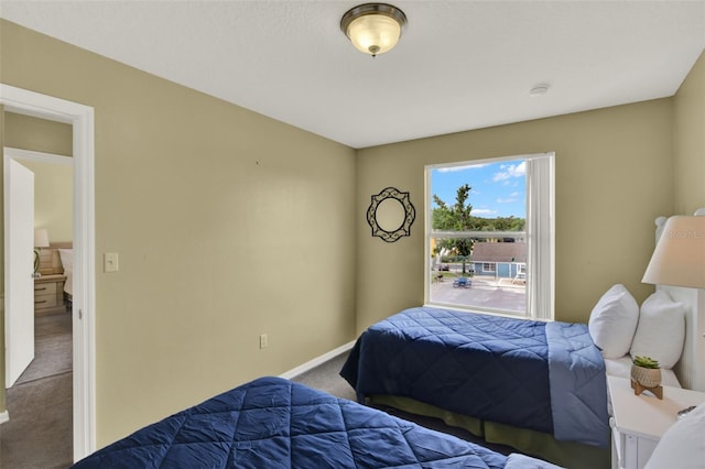 8716 Rain Forest Pl Unit D, Kissimmee, FL 34747 - carpeted bedroom featuring baseboards