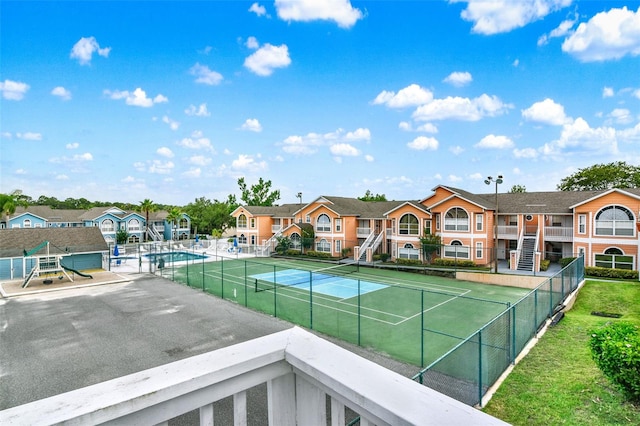 8716 Rain Forest Pl Unit D, Kissimmee, FL 34747 - view of tennis court featuring a residential view