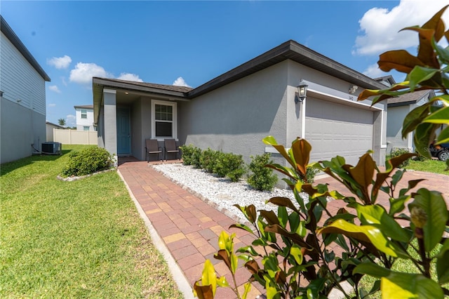 3442 Monaco Ln, Davenport, FL 33897 - ranch-style house featuring stucco siding and a garage