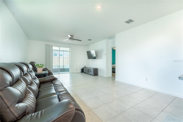 3442 Monaco Ln, Davenport, FL 33897 - living room featuring light tile patterned floors and ceiling fan