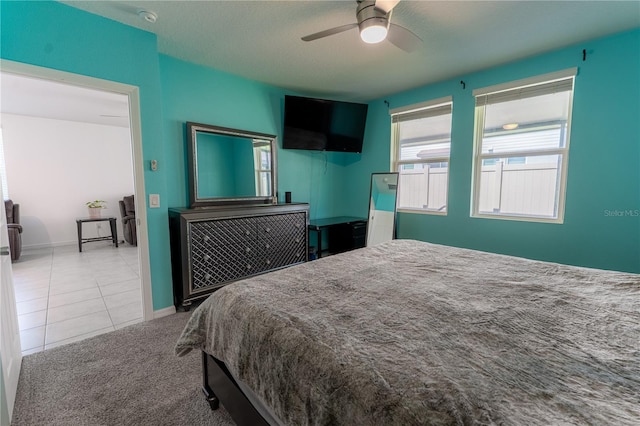 3442 Monaco Ln, Davenport, FL 33897 - carpeted bedroom featuring tile patterned floors and a ceiling fan
