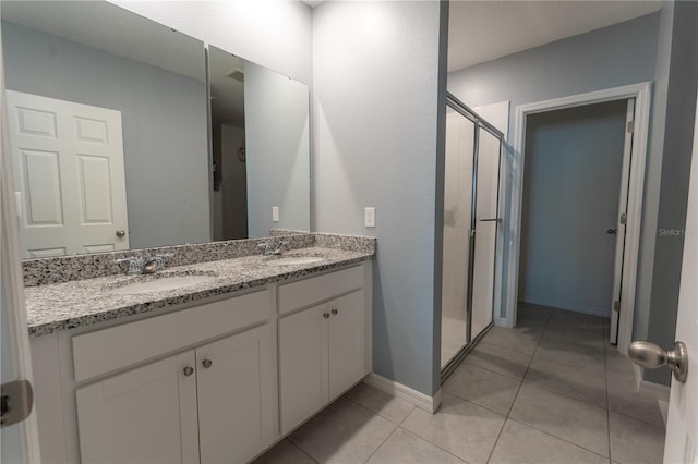 3442 Monaco Ln, Davenport, FL 33897 - bathroom featuring a stall shower, double vanity, and tile patterned floors