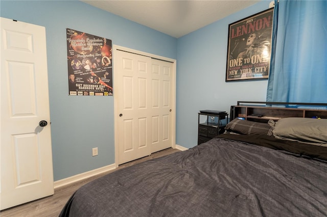 3442 Monaco Ln, Davenport, FL 33897 - bedroom featuring wood finished floors and a closet