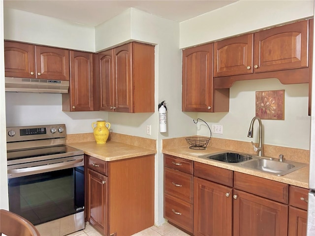 13 W Marbrisa Way, Kissimmee, FL 34743 - kitchen featuring stainless steel electric stove, under cabinet range hood, a sink, and light countertops