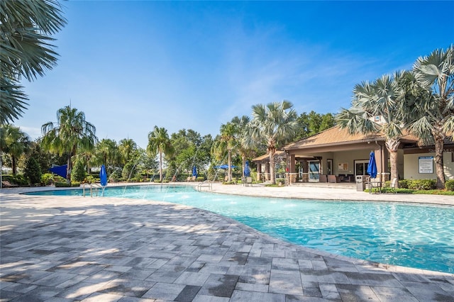 1312 Royal St George Blvd, Davenport, FL 33896 - community pool featuring a patio area