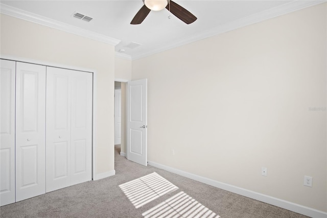 1312 Royal St George Blvd, Davenport, FL 33896 - unfurnished bedroom featuring light carpet, ornamental molding, a closet, baseboards, and ceiling fan