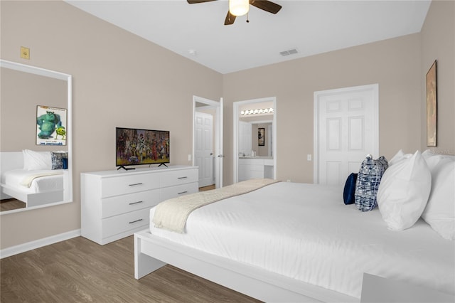 2307 Silver Palm Dr Unit 304, Kissimmee, FL 34747 - bedroom with wood finished floors, baseboards, ensuite bathroom, and a ceiling fan