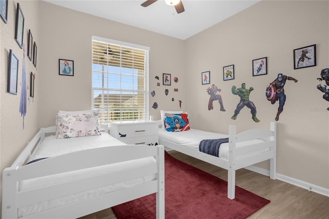 2307 Silver Palm Dr Unit 304, Kissimmee, FL 34747 - bedroom with wood finished floors, a ceiling fan, and baseboards
