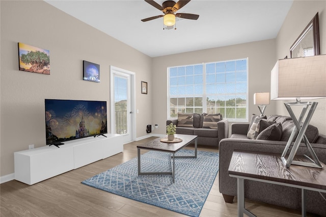 2307 Silver Palm Dr Unit 304, Kissimmee, FL 34747 - living room with wood finished floors, ceiling fan, and baseboards