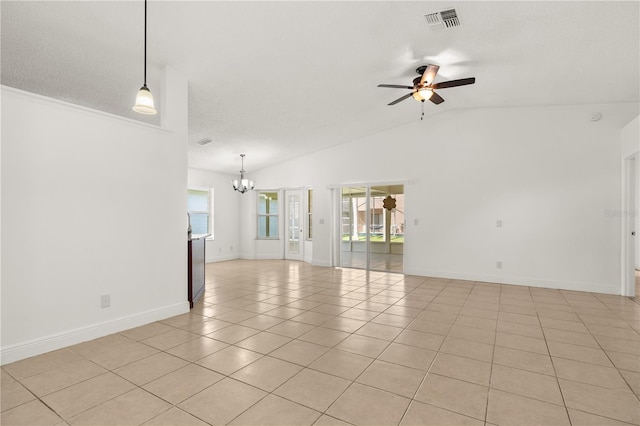 1914 Ellery Ln, Kissimmee, FL 34746 - unfurnished living room with a chandelier, plenty of natural light, a ceiling fan, light tile patterned floors, and lofted ceiling