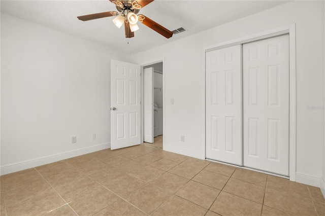 1914 Ellery Ln, Kissimmee, FL 34746 - unfurnished bedroom featuring light tile patterned floors, baseboards, a closet, and ceiling fan