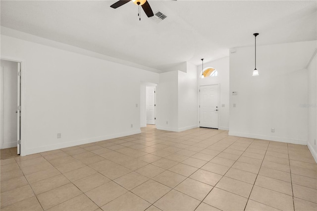 1914 Ellery Ln, Kissimmee, FL 34746 - spare room featuring vaulted ceiling, ceiling fan, light tile patterned floors, and baseboards