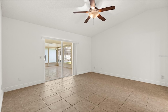 1914 Ellery Ln, Kissimmee, FL 34746 - unfurnished room featuring vaulted ceiling, light tile patterned flooring, a ceiling fan, and baseboards