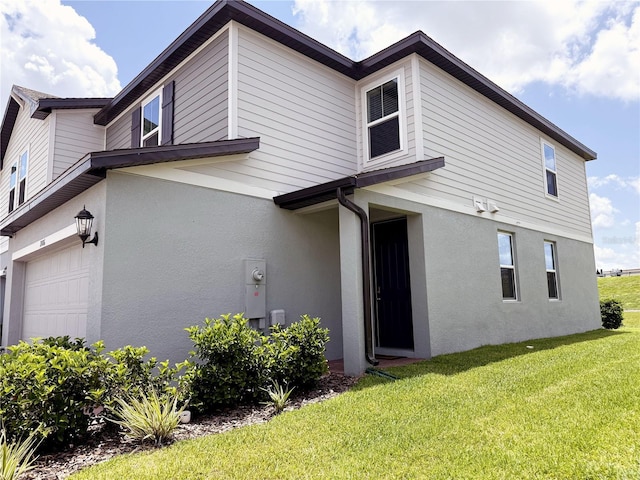 2086 Crape Jasmine Ln, Orlando, FL 32824 - view of front facade with stucco siding and a front lawn