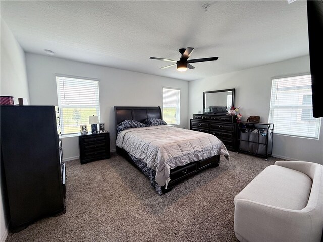 2086 Crape Jasmine Ln, Orlando, FL 32824 - carpeted bedroom featuring baseboards, a textured ceiling, and ceiling fan