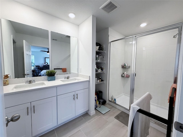 2086 Crape Jasmine Ln, Orlando, FL 32824 - bathroom featuring ensuite bath, a stall shower, double vanity, and ceiling fan