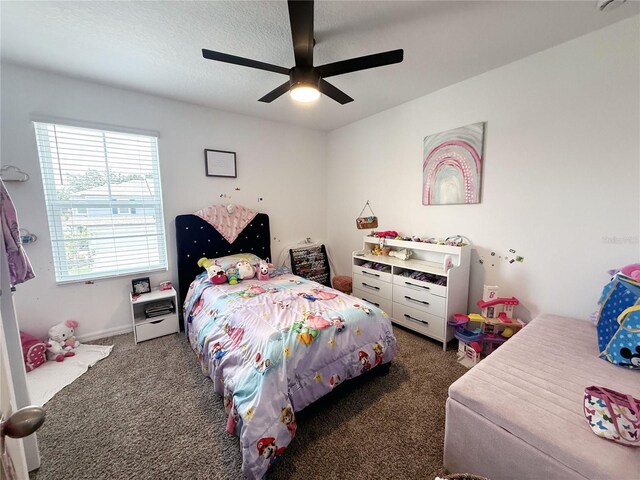 2086 Crape Jasmine Ln, Orlando, FL 32824 - carpeted bedroom with ceiling fan and baseboards