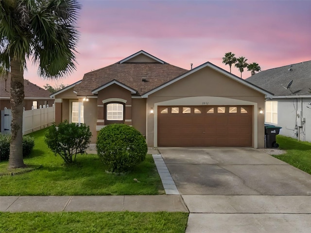 2912 Lazlo Ln, Orlando, FL 32837 - ranch-style house featuring stucco siding, an attached garage, driveway, and a shingled roof