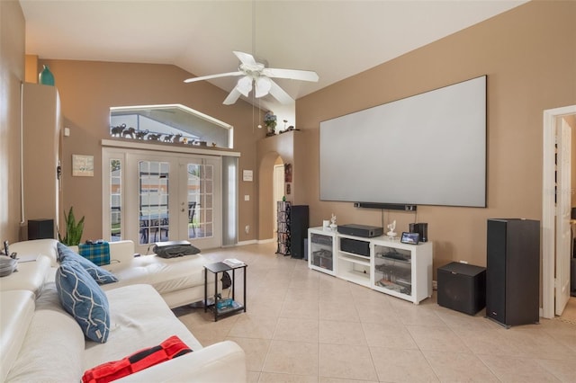 2912 Lazlo Ln, Orlando, FL 32837 - home theater with arched walkways, light tile patterned floors, a ceiling fan, vaulted ceiling, and french doors