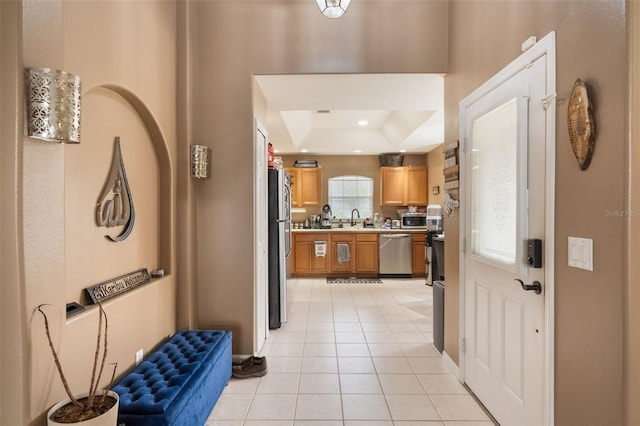 2912 Lazlo Ln, Orlando, FL 32837 - entrance foyer featuring a raised ceiling, light tile patterned floors, baseboards, and recessed lighting