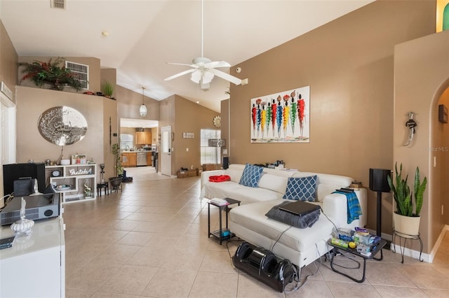 2912 Lazlo Ln, Orlando, FL 32837 - living area featuring ceiling fan, light tile patterned floors, high vaulted ceiling, and baseboards
