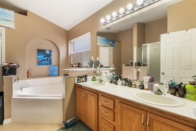 2912 Lazlo Ln, Orlando, FL 32837 - bathroom with a shower stall, a garden tub, double vanity, and tile patterned flooring