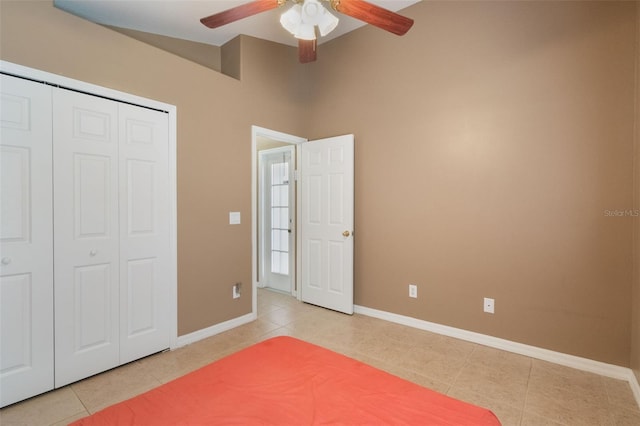 2912 Lazlo Ln, Orlando, FL 32837 - unfurnished bedroom with light tile patterned flooring, baseboards, a closet, and ceiling fan