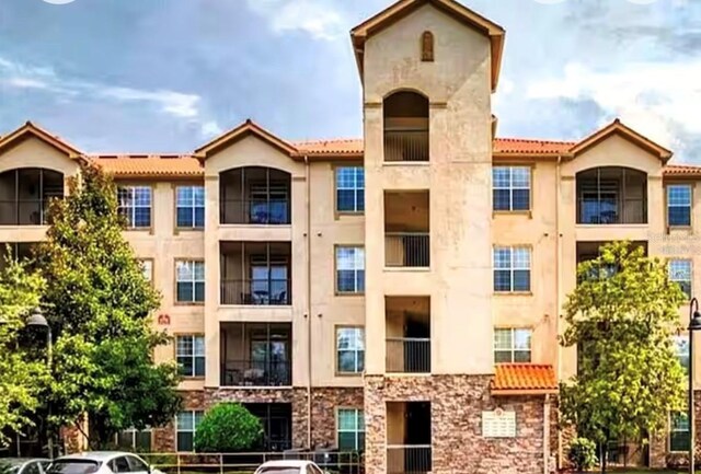 1375 Tuscana Ln Unit 1405, Davenport, FL 33896 - view of apartment building / complex