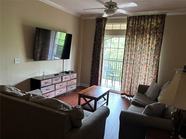 1375 Tuscana Ln Unit 1405, Davenport, FL 33896 - living area with wood-type flooring, crown molding, ceiling fan, baseboards, and a textured wall