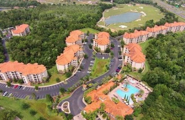 1375 Tuscana Ln Unit 1405, Davenport, FL 33896 - drone / aerial view of a nearby body of water and a pool area