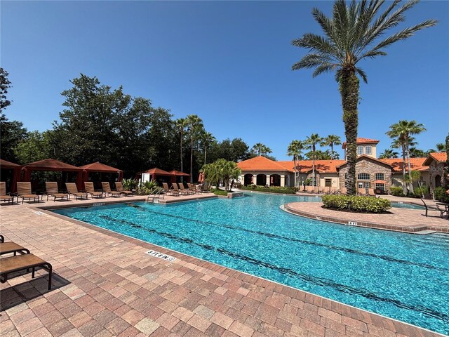 1375 Tuscana Ln Unit 1405, Davenport, FL 33896 - community pool with a gazebo and a patio