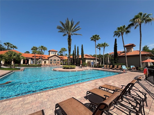 1375 Tuscana Ln Unit 1405, Davenport, FL 33896 - community pool with a patio area