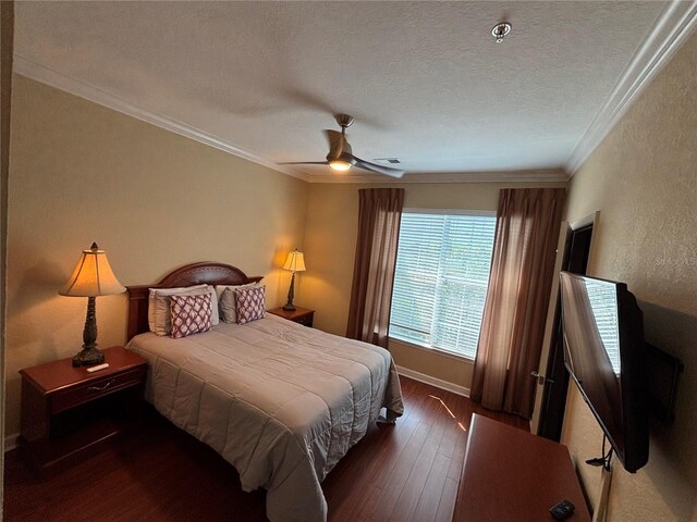 1375 Tuscana Ln Unit 1405, Davenport, FL 33896 - bedroom with ornamental molding, hardwood / wood-style floors, a textured ceiling, a textured wall, and ceiling fan
