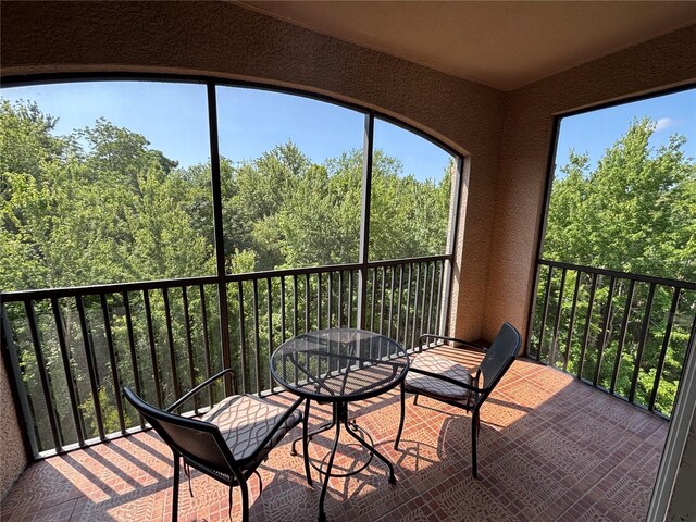 1375 Tuscana Ln Unit 1405, Davenport, FL 33896 - balcony featuring a view of trees