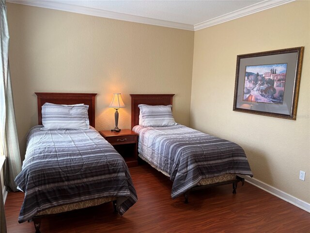 1375 Tuscana Ln Unit 1405, Davenport, FL 33896 - bedroom with wood finished floors, crown molding, and baseboards