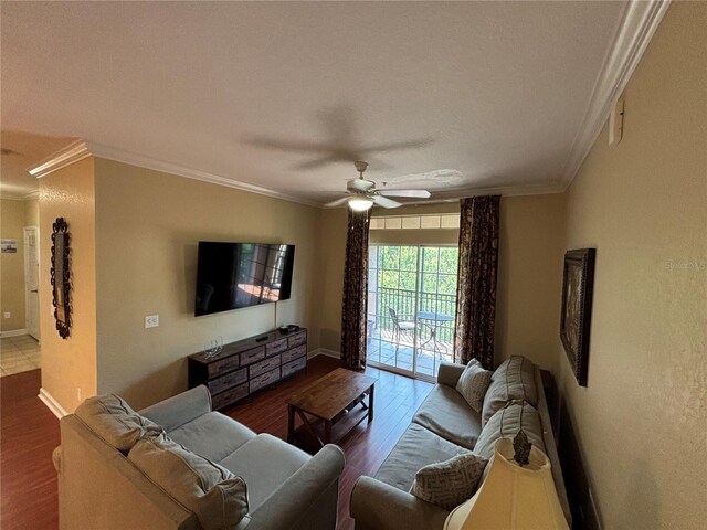 1375 Tuscana Ln Unit 1405, Davenport, FL 33896 - living room featuring crown molding, wood finished floors, a ceiling fan, and baseboards