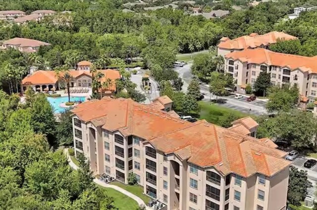 1375 Tuscana Ln Unit 1405, Davenport, FL 33896 - bird's eye view of a pool area and apartment complex / building