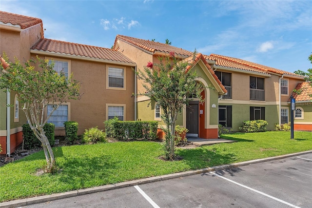 437 Fountainhead Cir Unit 283, Kissimmee, FL 34741 - view of property featuring uncovered parking