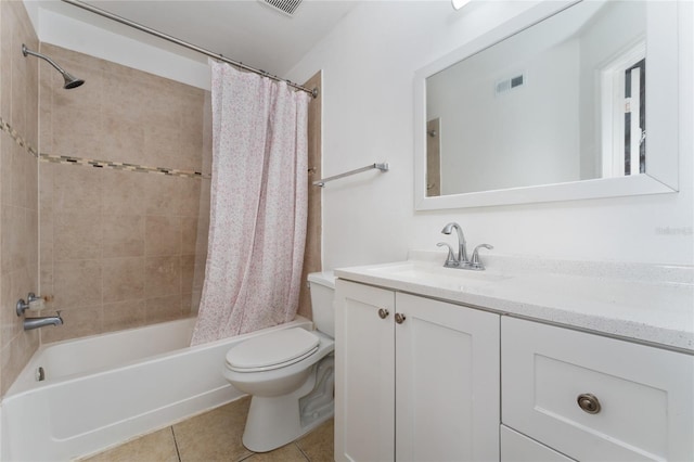 437 Fountainhead Cir Unit 283, Kissimmee, FL 34741 - full bathroom featuring vanity, toilet, tile patterned flooring, and shower / bath combo