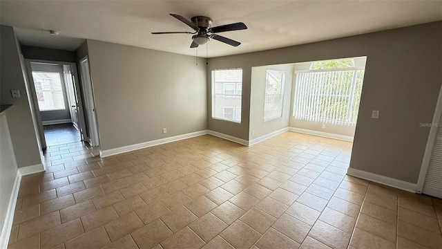 4728 Walden Cir Unit 32, Orlando, FL 32811 - tiled empty room with ceiling fan and baseboards