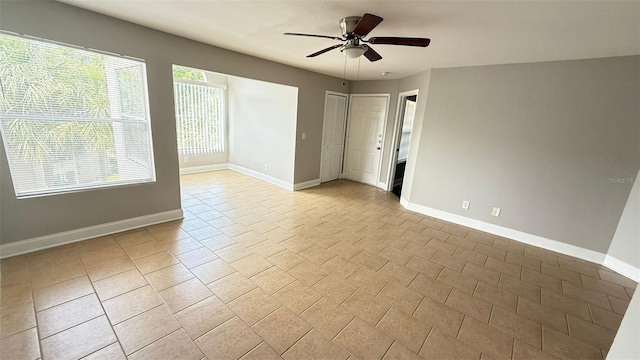 4728 Walden Cir Unit 32, Orlando, FL 32811 - empty room with baseboards and ceiling fan