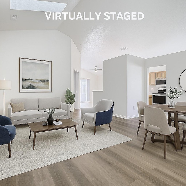 1851 Hammock Moss Dr, Orlando, FL 32820 - living area with lofted ceiling, light wood-style flooring, baseboards, and ceiling fan