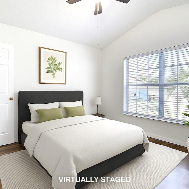 1851 Hammock Moss Dr, Orlando, FL 32820 - bedroom with lofted ceiling, wood finished floors, baseboards, and a ceiling fan
