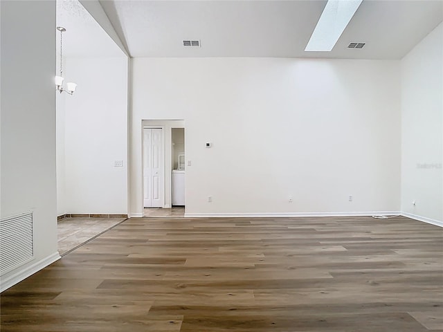 1851 Hammock Moss Dr, Orlando, FL 32820 - unfurnished room with wood finished floors, a skylight, and baseboards