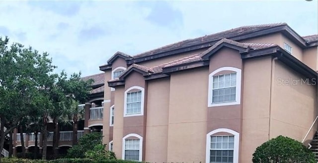 13838 Fairway Island Dr Unit 1418, Orlando, FL 32837 - view of side of property featuring stucco siding