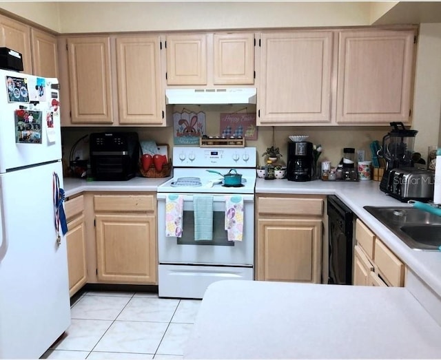 13838 Fairway Island Dr Unit 1418, Orlando, FL 32837 - kitchen with white appliances, under cabinet range hood, light brown cabinetry, and a sink
