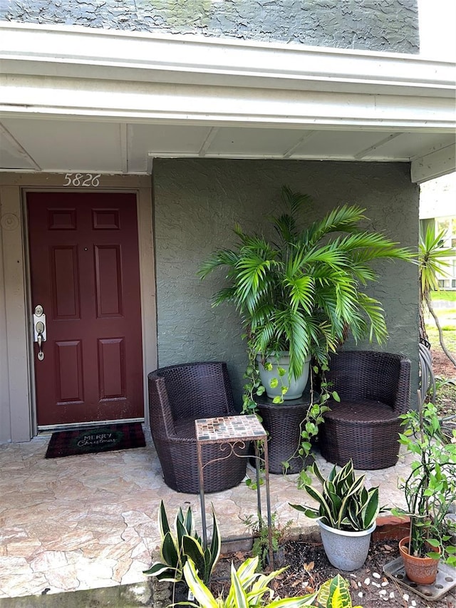 5826 Peregrine Ave Unit F01, Orlando, FL 32819 - doorway to property with stucco siding