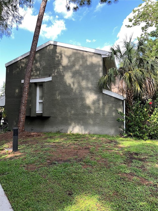5826 Peregrine Ave Unit F01, Orlando, FL 32819 - view of side of home with stucco siding