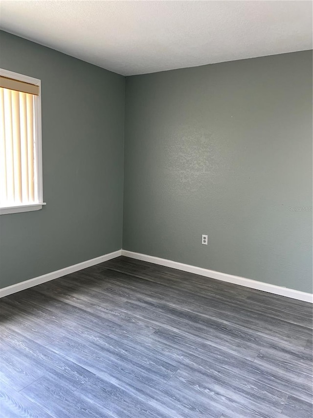 5826 Peregrine Ave Unit F01, Orlando, FL 32819 - empty room with baseboards and wood finished floors