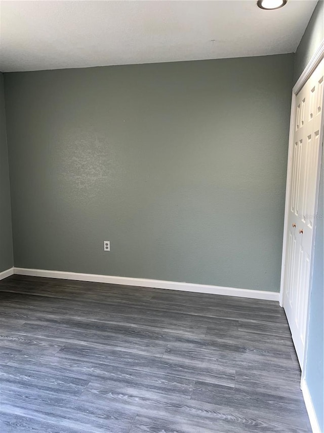 5826 Peregrine Ave Unit F01, Orlando, FL 32819 - empty room with baseboards and wood finished floors